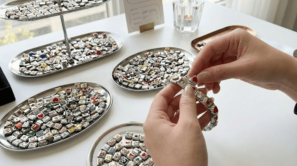 Hands making colorful accessories